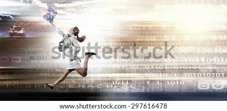 Young businesswoman in suit running at full pelt