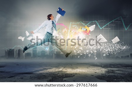 Young businessman in suit running in a hurry