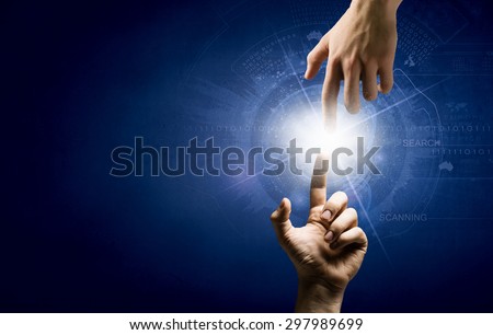 Close up of two hands reaching each other with fingers