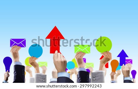 Crowd of businesspeople lifting up hands with conceptual cards