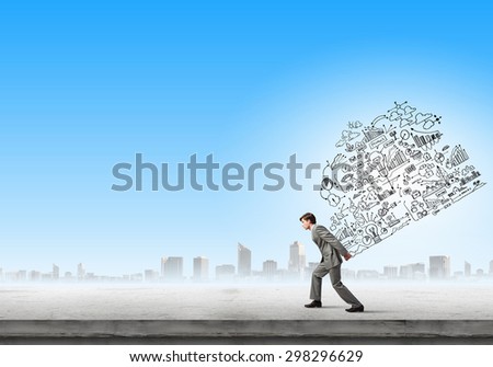 Young businessman carrying his great business plan on back