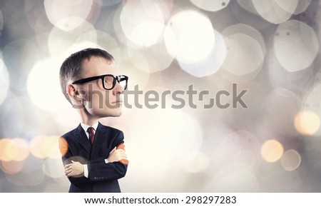 Young funny man in glasses with big head