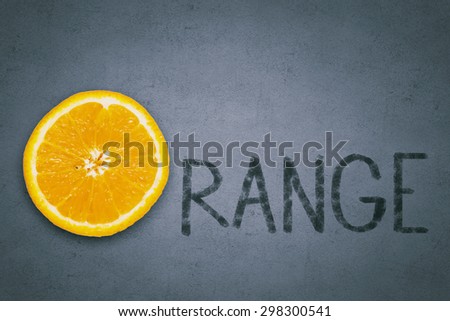 Word orange with slice of orange fruit instead of letter O