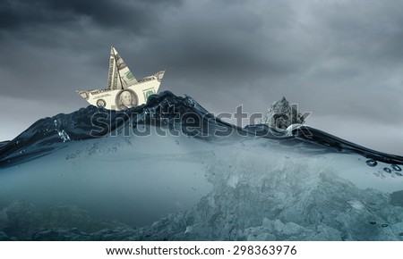 Paper ship floating on water on stormy waves
