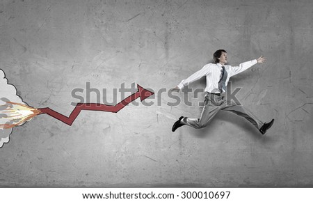 Young speedy businessman running in a hurry