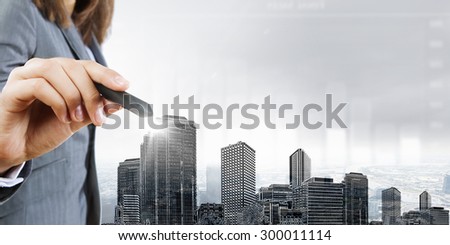 Chest view of businesswoman drawing sketches of construction project on screen