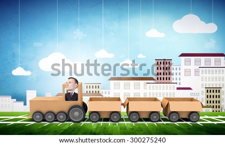 Funny cartoon image of businessman riding carton box