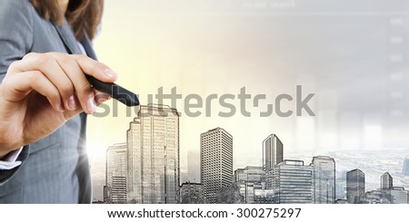 Chest view of businesswoman drawing sketches of construction project on screen