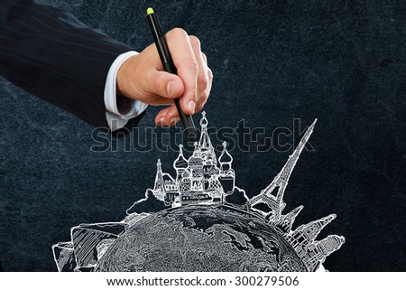 Businessman hand drawing dream travel around the world