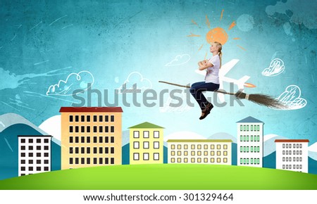 Young girl in casual flying on broom high in sky