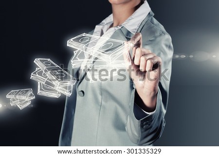 Chest view of businesswoman drawing money banknotes on screen