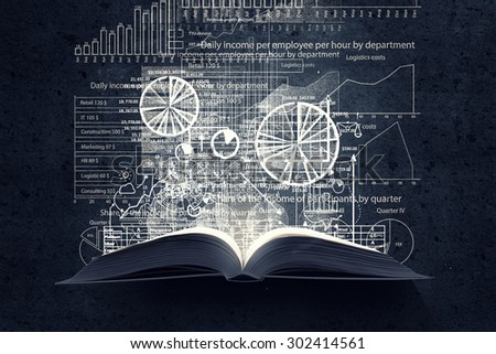 Old opened book with business sketches over black background