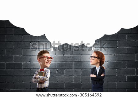 Funny woman and big headed man in glasses with book in hands