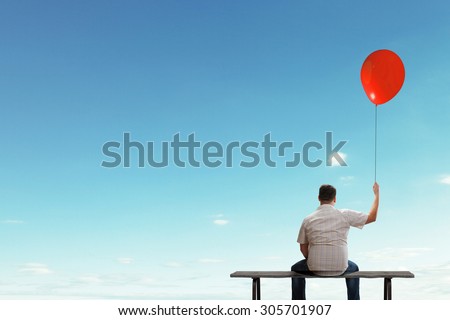 Fat man sitting on bench with his back with balloon in hand