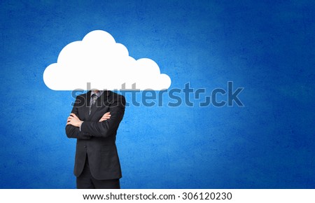 Businessman standing with his head in cloud