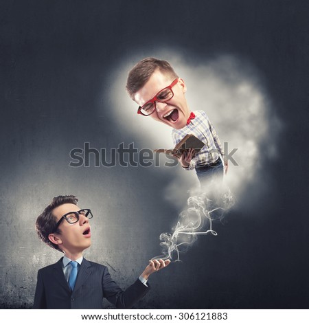 Funny big headed man in glasses with book in hands