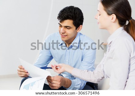 Two students working in cooperation and having discussion