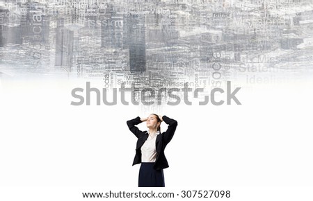 Young businesswoman with hands on head thinking something over