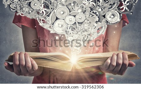 Young woman in red dress with book in hands and gears mechanism in air