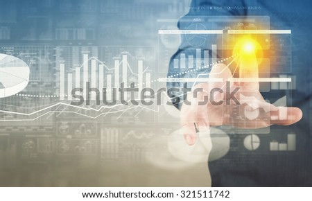 Businessman hand pushing business graph on touch screen interface