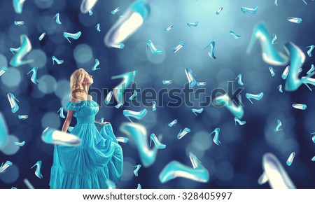 Young cheerful woman in blue dress and many falling shoes