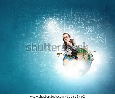 Wideangle picture of funny schoolgirl with paper plane. Elements of this image are furnished by NASA