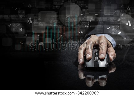 Hand of businessman in suit on dark digital background using wireless computer mouse