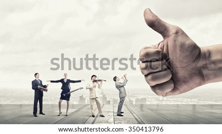 Conductor hand and business people playing different music instruments