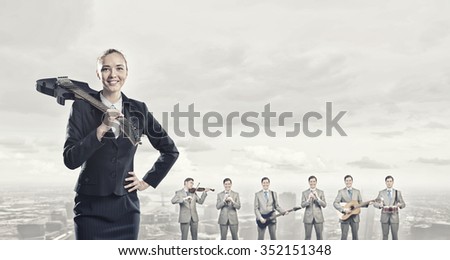 Man orchestra playing different music instruments and woman leader