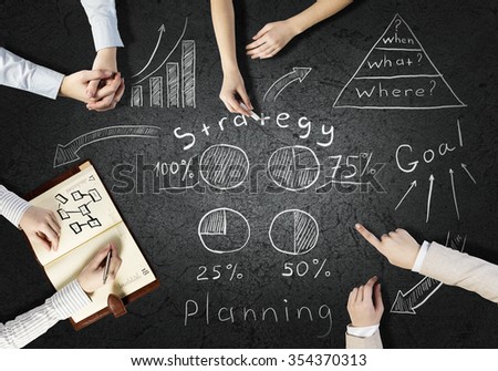 Top view of people hands drawing business teamwork strategy