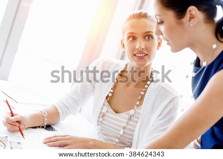 Two female colleagues in office