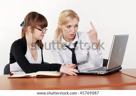 two charming business woman talking in office