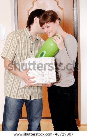 a charming young couple settlers went into their new apartment.Young couple thrilled
