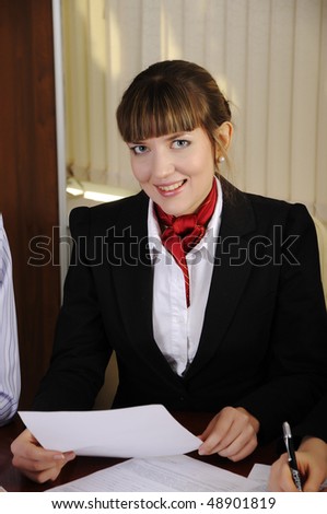 Young charming businesswoman encouraging the success of the case