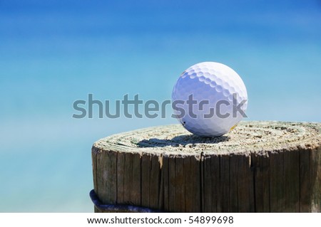 golf ball on the background of the ocean on the column