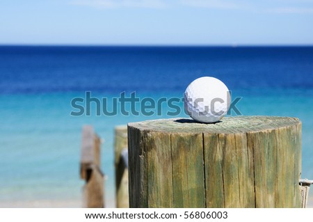 golf ball on the background of the ocean on the column