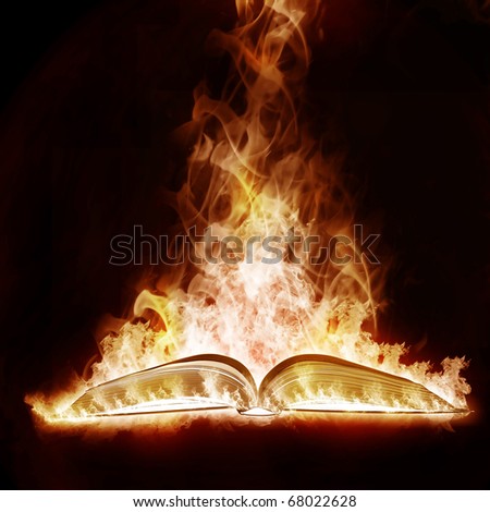 Mysterious Book open arms fire on a black background
