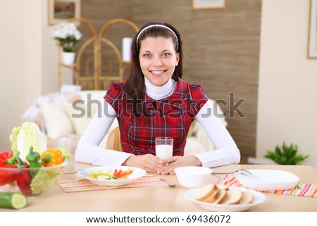 a young girl cooking  healthy food at home