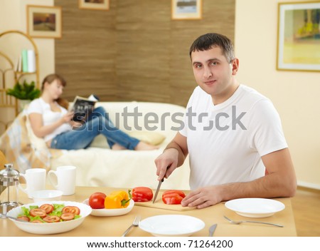 a husband preparing healthy food at home
