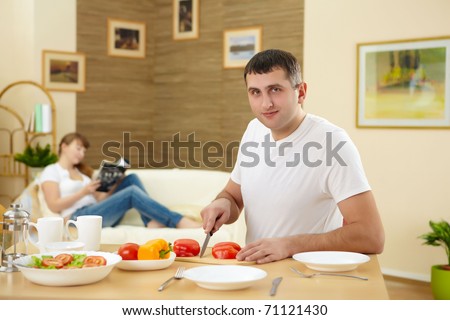 a husband preparing healthy food at home