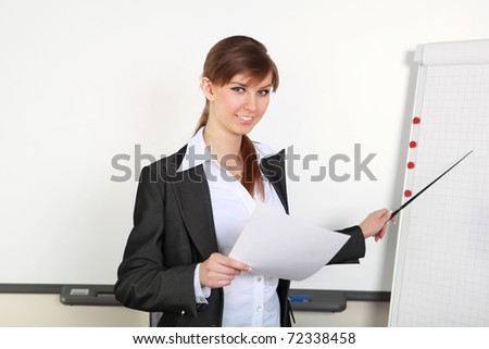 a young business woman making presentation in an office