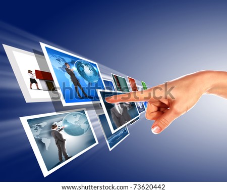 Hand touches the flow of images. Symbol of media streams