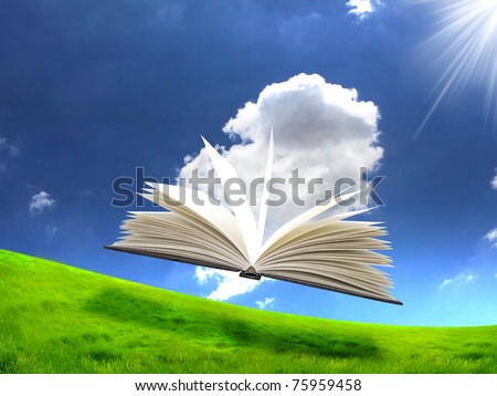 book in the air against green panoramic nature landscape