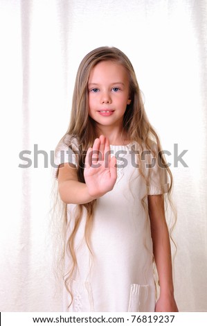 Portrait of a young beautiful girl. Girl various hand gestures.