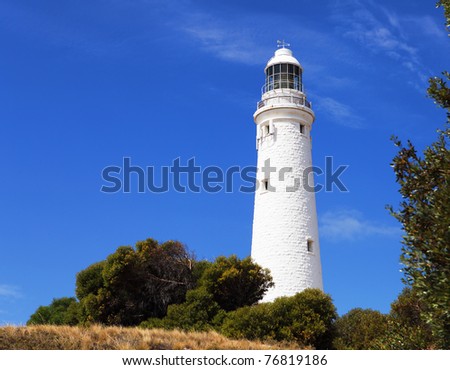 Lighthouse white against the blue sky. Symbol of hope and faith in the future