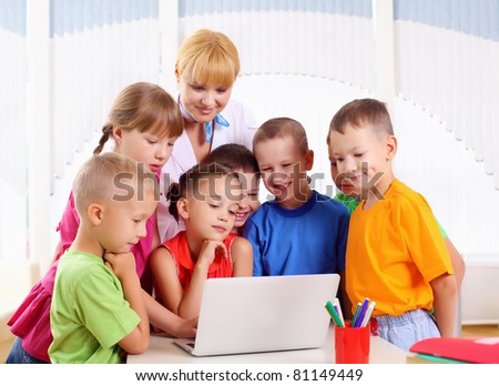 Deals Laptops  Students on Teacher Deals With Students For A Laptop At School Stock Photo