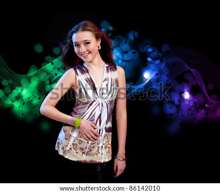 young woman dancing at disco or a night club