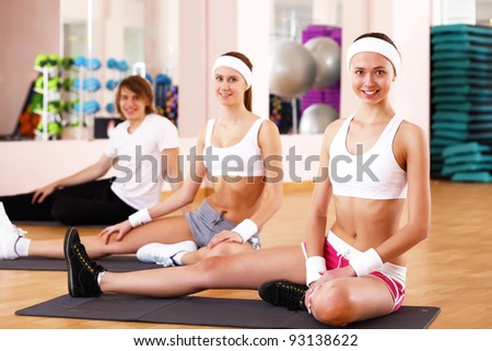 Young woman in sport wear doing sport in gym