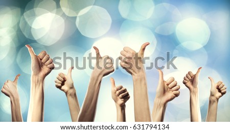 Group of people rise hands