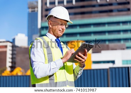 Engineer builder at construction site